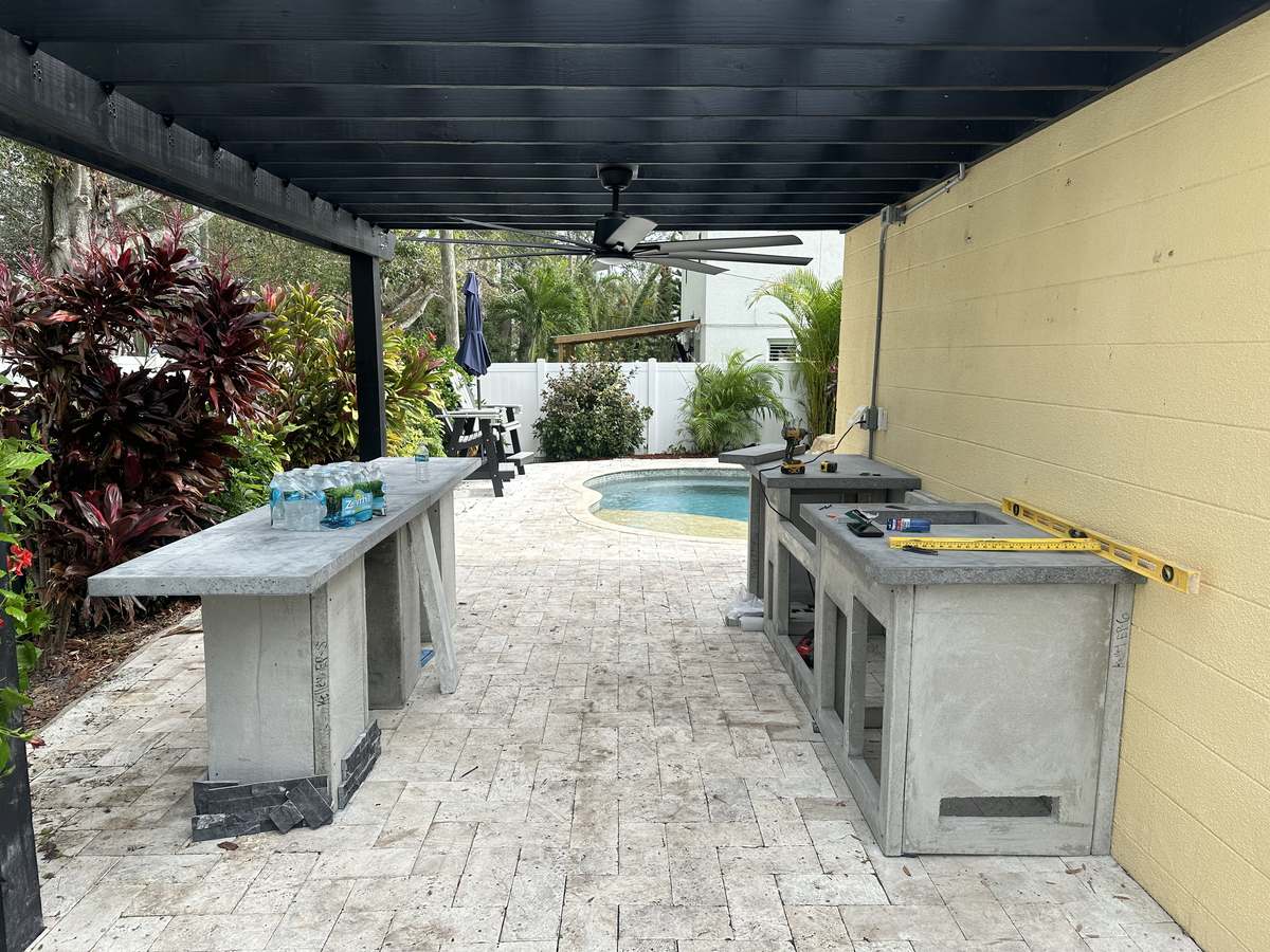 L-shaped concrete outdoor kitchen