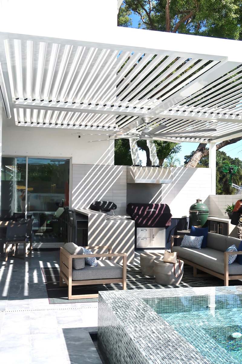 Poolside concrete kitchen with fire feature